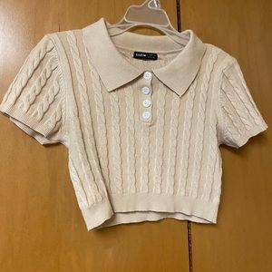 Cutest cropped sweater top. Knitted pattern, and beige color.